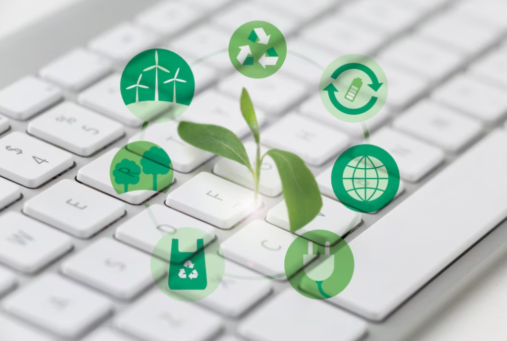 Keyboard with eco-symbols and a sprouting plant emphasizing green technology